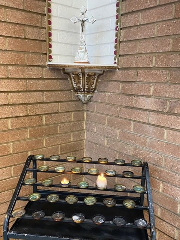 Votive candles alight