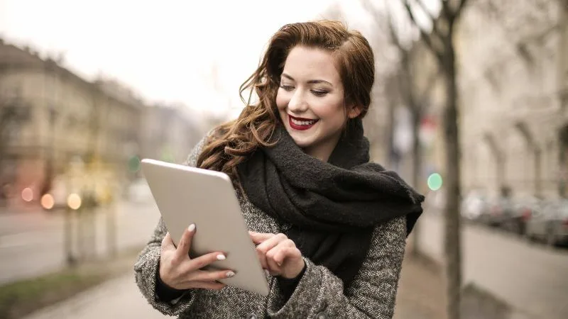 woman reading news on tablet