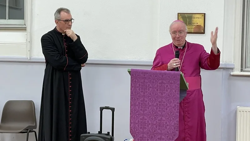Canon James McAuley listening to Bishop Philip speaking on the launching of the "Cathedral150" project.